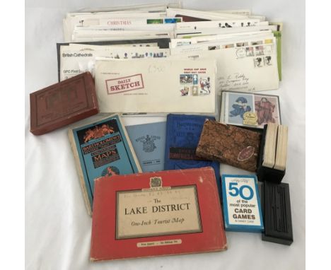 A large collection of first day covers, vintage card games and tourist maps. To include Daily Sketch 1966 world cup issue. 