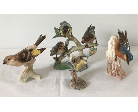 A collection of 4 Goebel bird figures to include a Nuthatch and a Siskin group.  