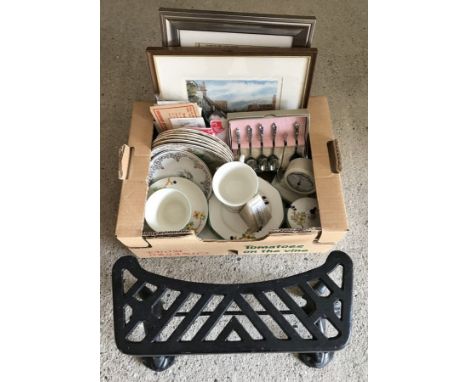 A box of miscellaneous items. To include vintage ceramics, stamps, prints, cast iron adjustable fire trivet & apostle spoons.