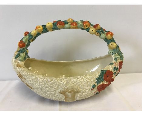 A Clarice Cliff, Newport Pottery Celtic Harvest basket shaped handled fruit bowl. Circa 1930's. Slight crack to inside runnin