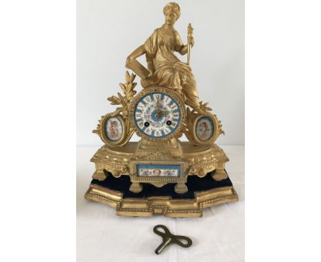 A French gilt mantle clock of decorated with the figure of Liberty to top with hand painted panels. Complete with gilt wooden