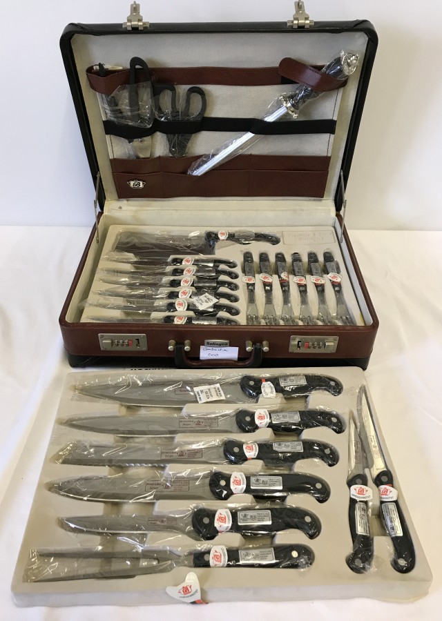 A cased set of Solingen Chef's knives. By Berman & Benz. Fitted ...