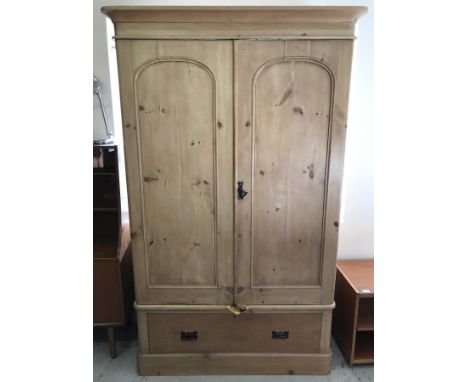 A Victorian pine 2 door wardrobe with drawer and removable pelmet. Internal hanging and shelf. Interior has been painted. App