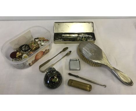 A collection of miscellaneous items. To include Mdina style paperweight, penknives, pill boxes, sugar tongs, and a cinnabar s