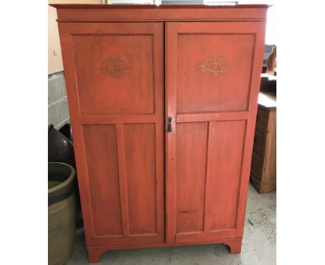 A vintage oak 2 door tallboy, painted red. With internal hanging rail, shelves and drawers. Approx. 107 x 154cm.