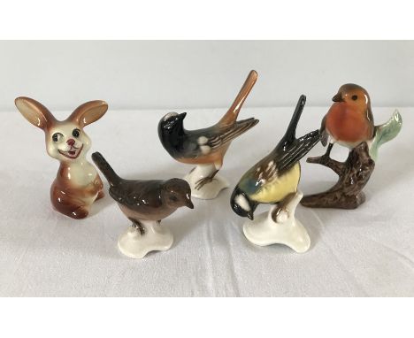 A collection of 4 Goebel ceramic birds together with a ceramic Goebel rabbit. To include a Redstart, Robin and Great Tit. 