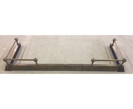 A vintage extending brass fire fender. With ball and rail design to corners. External 132cm x 46cm, internal 122cm x 41cm clo