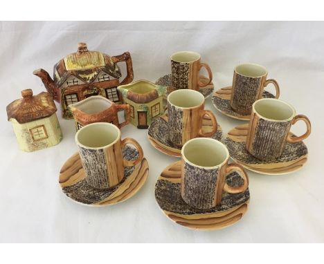 A collection of cottage ware. Together with Price Kensington bark effect coffee mugs and saucers.  