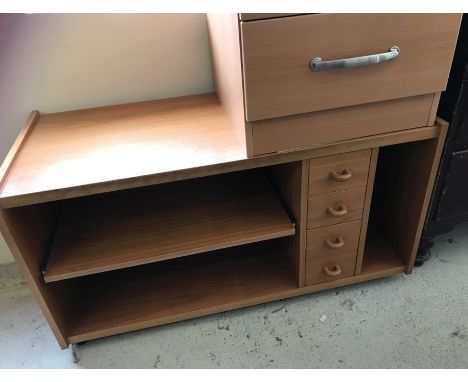 A vintage teak unit / coffee table on castors. With 4 small drawers and shelf. Approx. 100cm wide x 53cm tall.