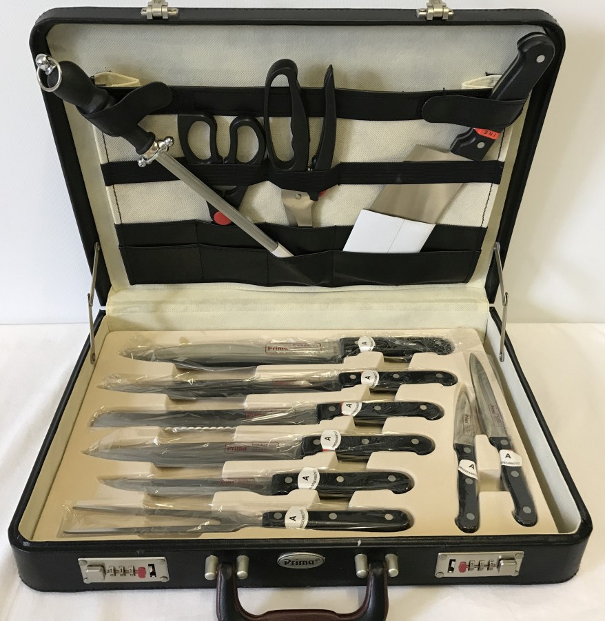 A set of chef's knives by Prima. In leather briefcase. Unused.