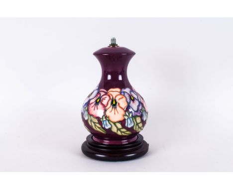 Moorcroft Modern Tubelined Lamp Base Spring Flowers, Maroon Ground. Stands 8'' i height,