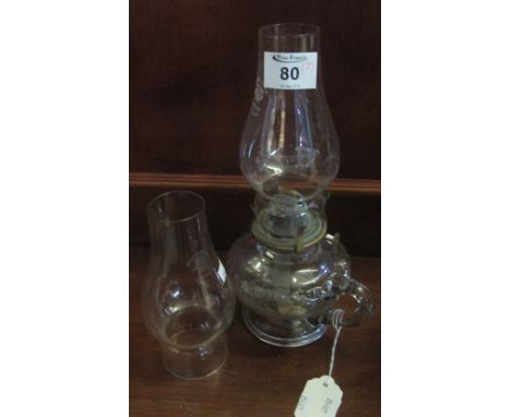 Small glass chamber oil lamp with clear chimney and spare chimney. (2)(B.P. 24% incl. VAT)