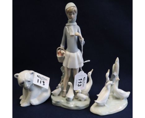 Lladro porcelain girl with ducks, Lladro polar bear and Nao group of ducks (3).(B.P. 24% incl. VAT)