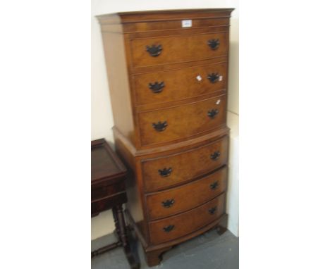 Reproduction walnut, bow-front chest on chest stading on bracket feet.(B.P. 24% incl. VAT)