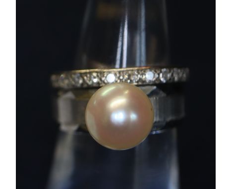 18ct white gold, full diamond eternity ring together with a 14ct white gold pearl ring. Total weight 6.9g approximately.(B.P.