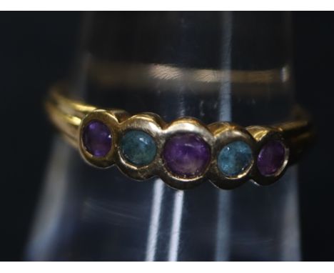 9ct gold purple and green stone dress ring.(B.P. 24% incl. VAT)