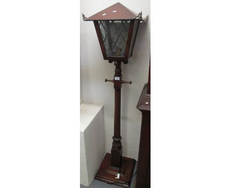 Modern oak lantern-shaped standard lamp on a square step base.(B.P. 24% incl. VAT)