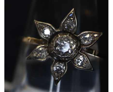 Victorian flower-head diamond ring with yellow metal shank. Approximate weight is 2g.(B.P. 24% incl. VAT) CONDITION REPORT: C