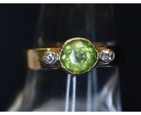 A 9 ct gold peridot and diamond ring. 3.4g approximately.(B.P. 24% incl. VAT)