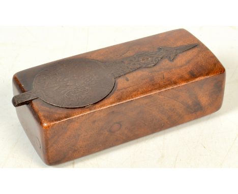 An early 19th century rifle steel patch box set in the original section of walnut stock, the hinged lid decorated with a hunt