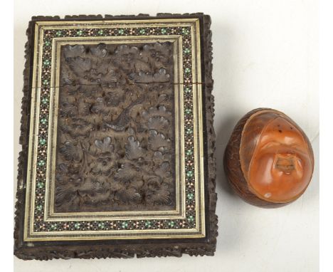 A Sadeli carved case and a marked carved vegetable ivory netsuke.