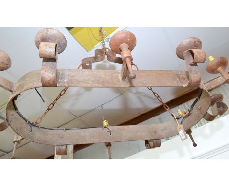 A wrought iron chandelier.  Dimensions: 1030 x 605mm