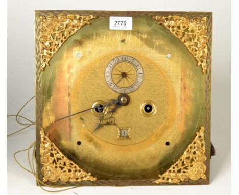 An eight day longcase clock with five pillar movement and brass 12 inch dial, lacks chapter ring, the matt centre with silver