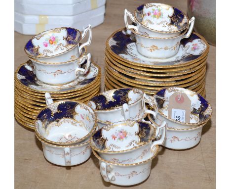 A Coalport late Edwardian tea service comprising of twelve cups and twelve saucers, together with twelve 7" plates.  Twelve s