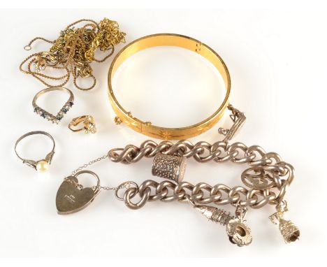 A heavy silver charm bracelet etc.   Condition report:  Charm bracelet - 74.5g.
We are unsure of the base metal in the bangle