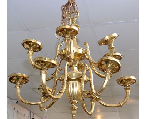 A pendant brass chandelier in classical style with two tiers of six branches with Art Nouveau style glass shades, one missing