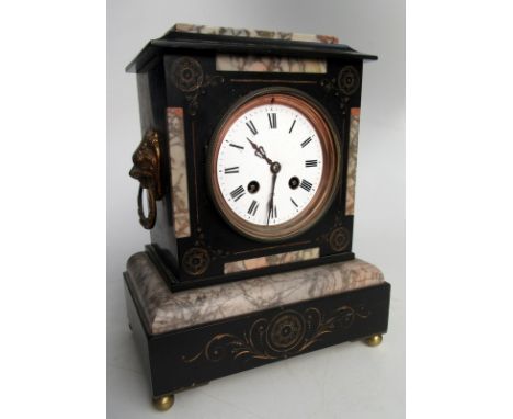 A slate and marble mantle clock with cast gilt lion mask handles, height 28cm.