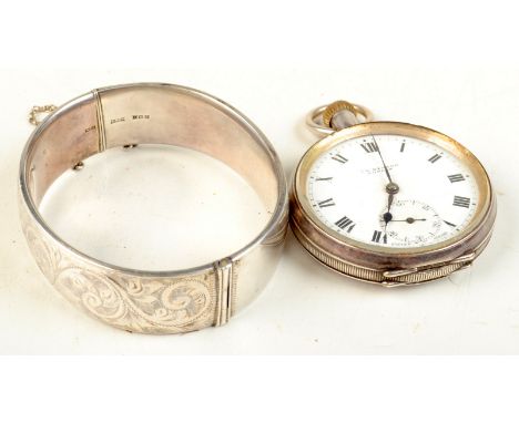 A Benson open faced silver cased keyless pocket watch and a modern silver bangle.