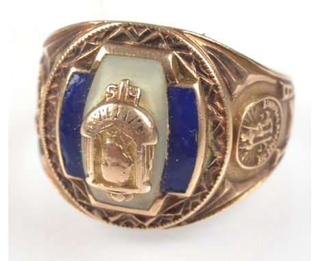 An American fraternity ring dated 1947 in 10k. gold set with blue enamel and pearl beneath a portrait bust named 'Marshall', 