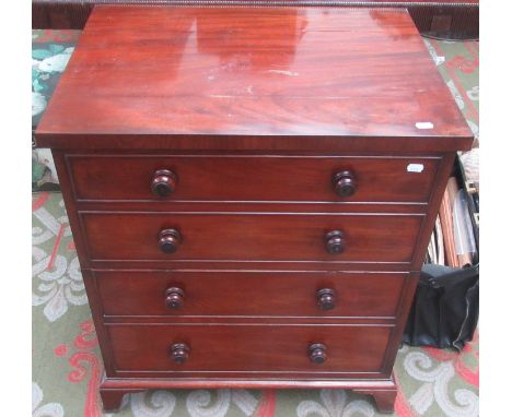 An early Victorian mahogany commode with dummy drawers and splade bracket feet imitating a chest.