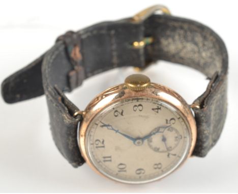 A gentleman's 9ct. gold cased wristwatch with engine turned silver face.