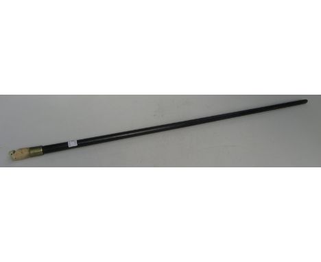 An ebony walking stick with a bone whistle finial, length 89cm.   Condition report: It is ebony. 
