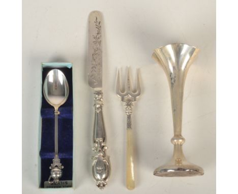 A Victorian silver butter knife, Birmingham 1853, together with a late Victorian silver spill, a souvenir spoon and a cake fo