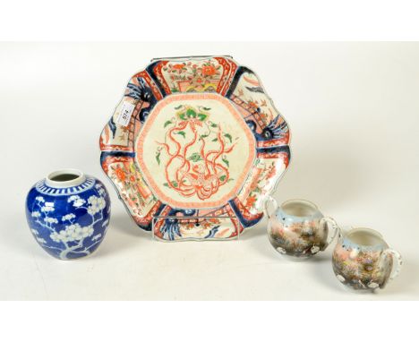 A Chinese blue and white prunus pattern jar, height 12cm, an Imari dish, diameter 31cm, a Japanese porcelain jug and matching