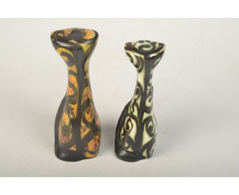 Two Celtic Pottery cats, one green, height 17cm, the other orange, height 18.5cm.