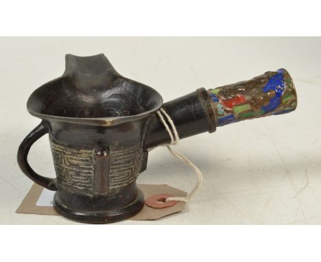A Chinese metal oil pourer with an enamel decorated handle, height 5.5cm.