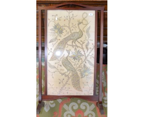 An Indian silk and silver metal thread embroidered firescreen depicting peacocks and snakes on flowering branches, with a mah
