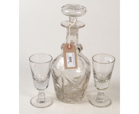 A cut glass decanter and a pair of rummers.