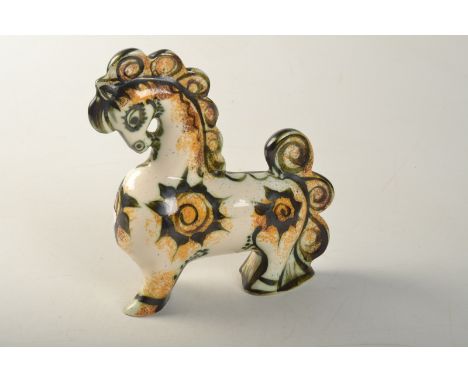 A Celtic Pottery orange "Medallion" pattern horse, height 25cm.