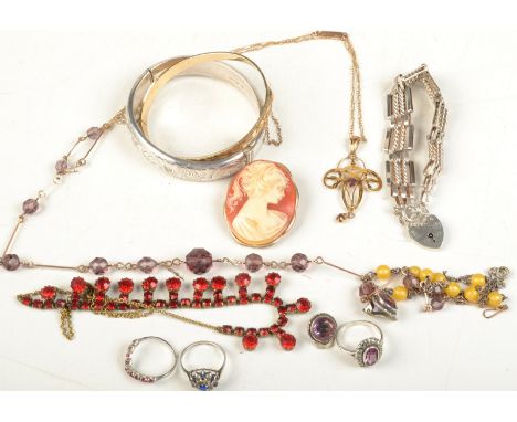 An Art Nouveau gold pendant and chain, a silver bangle, a silver bracelet etc. 