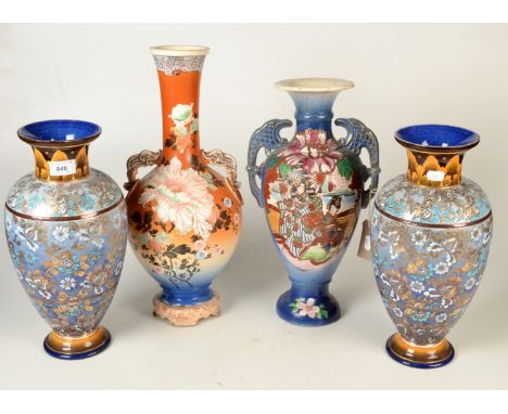 A pair of Royal Doulton Slater patent vases with blue textured floral enamel bodies beneath a leaf decorated everted rim, hei