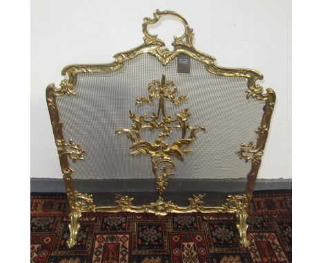A reproduction French rococco brass and mesh fire screen.  The screen has no age, it is modern but quite good quality, it's i
