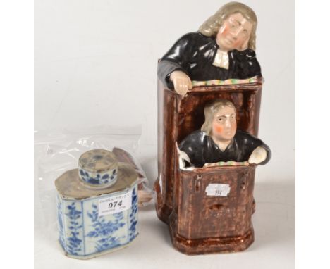 A Staffordshire group "The Vicar and Moses", together with a 18th century blue and white tea caddy, each damaged.