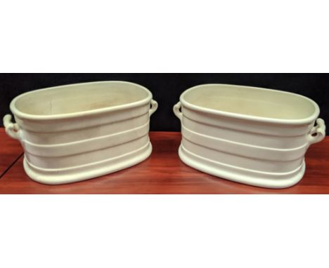 A pair of twin handled ceramic troughs, H.21cm L.51cm D.32cm