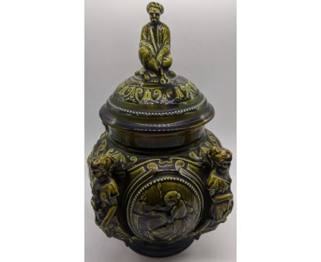 An 18th century French green ceramic tobacco pot and cover