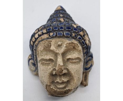 A late 18th/early 19th century Thai blue glazed Buddha head, H.6.5cmProvenance: Galerie Zache, Vienna